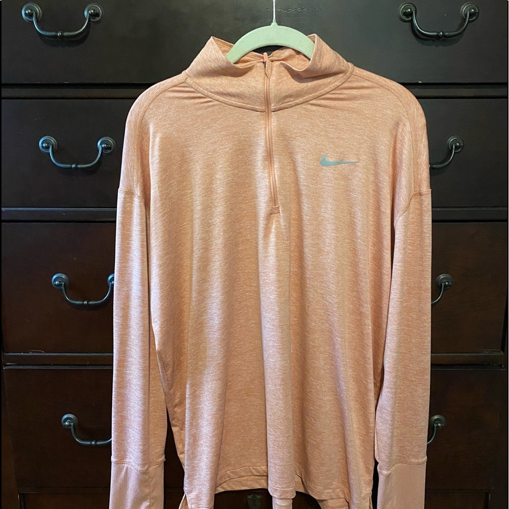 Nike Running dry fit long sleeve shirt with thumb holes. Melon color.